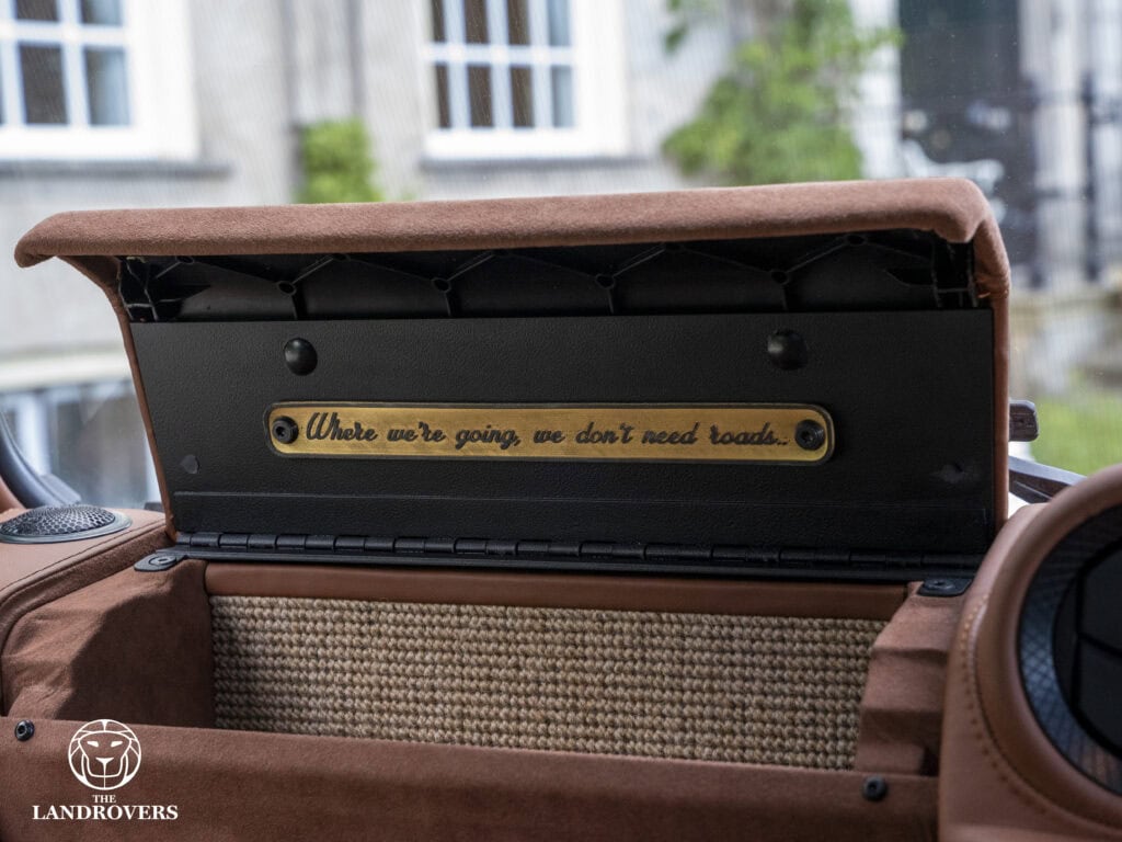 detail of the glove box of one of the best land rover defender builders in the world, that show's a glove box with small text