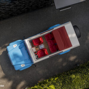 drone shot from above of The Landrovers Strawberry custom build defender with open roof