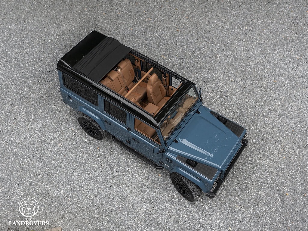 The Landrovers defender from above with open automatatic slinding roof