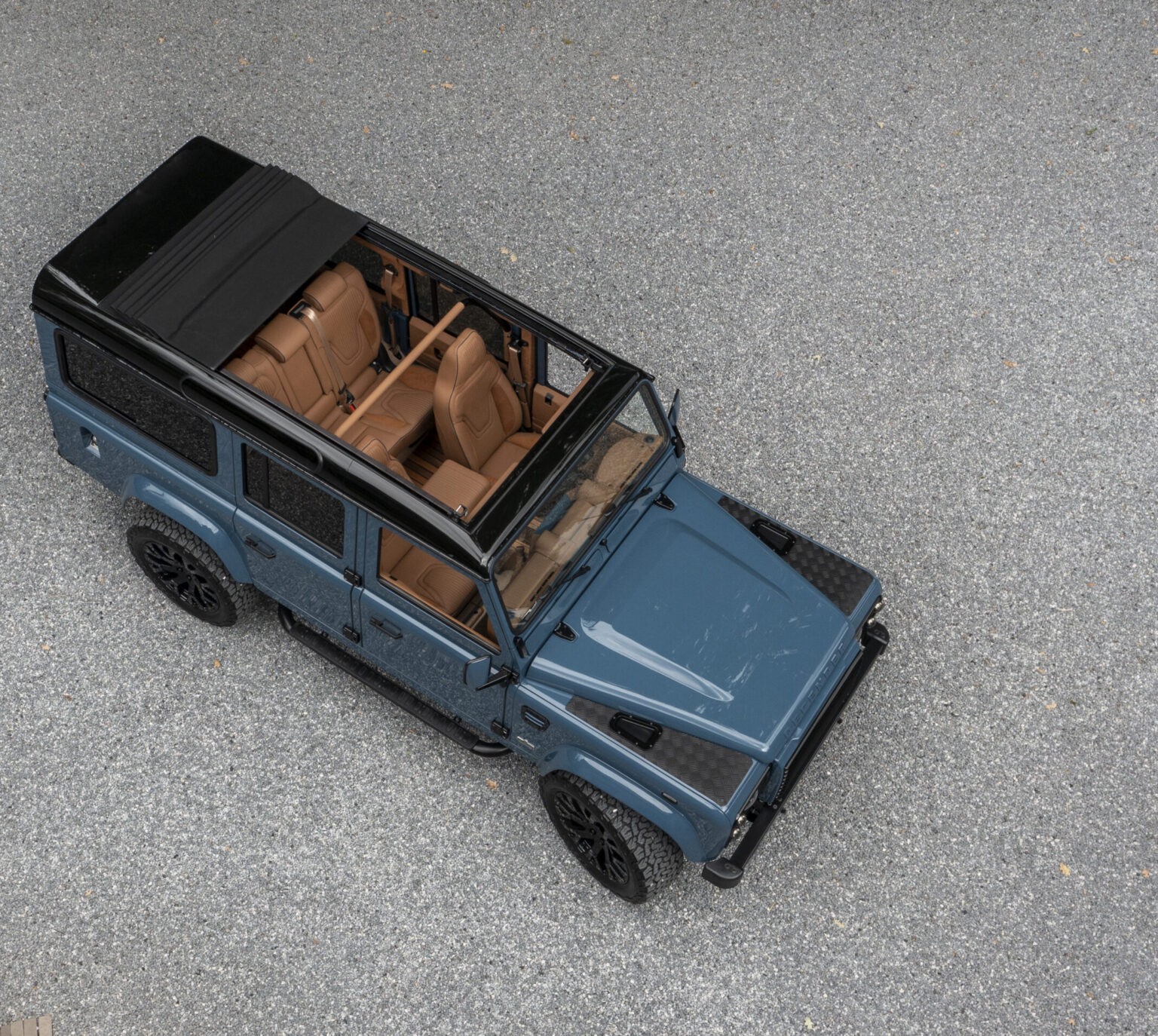 The Landrovers defender from above with open automatatic slinding roof