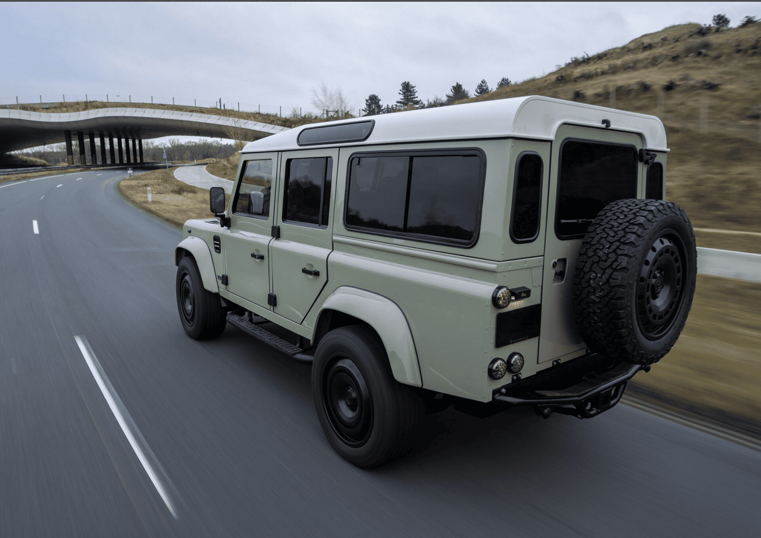 green land Rover Defender Panterra from the side