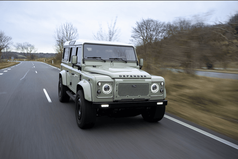 Top gear journalist driving Defender Panterra on road