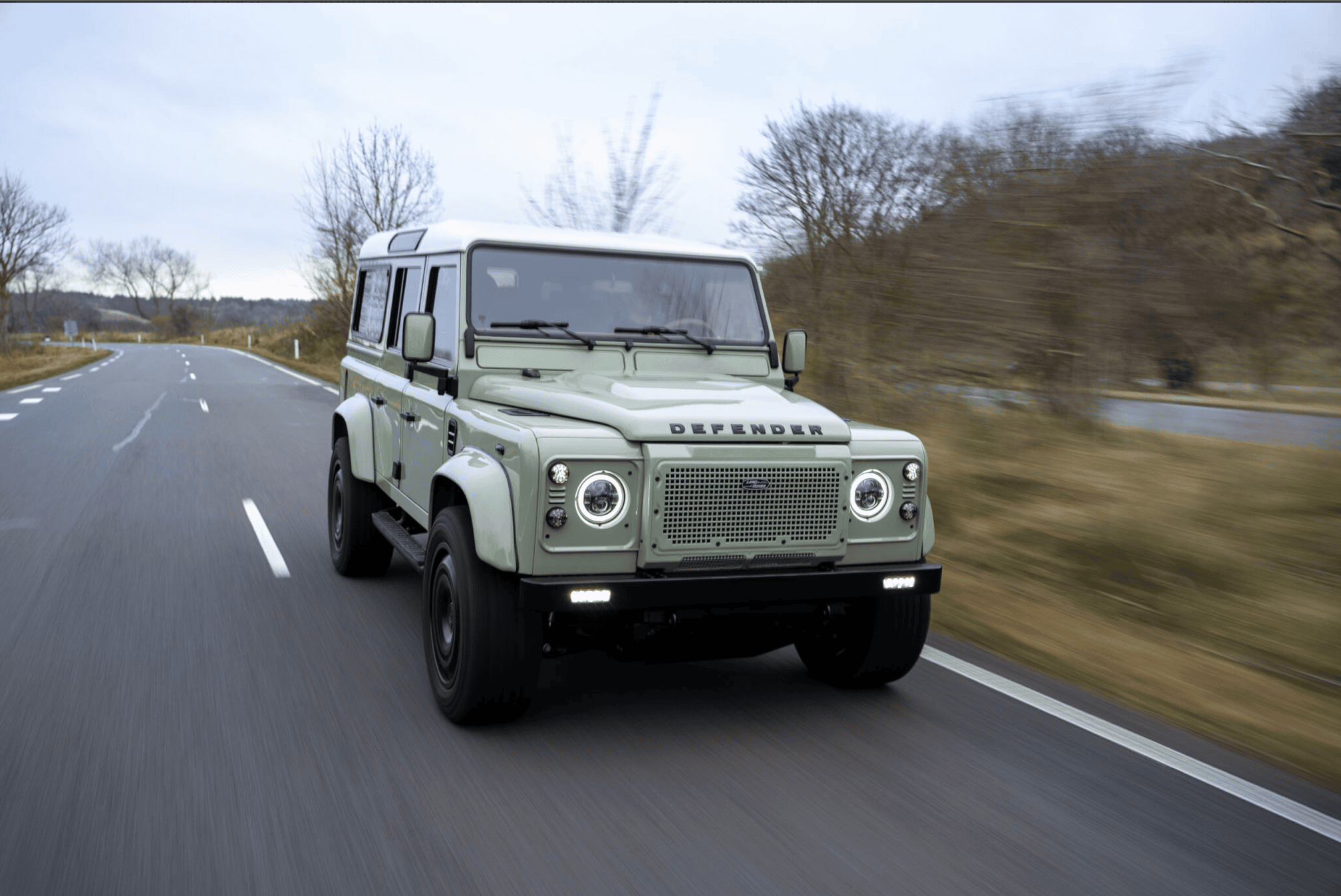 Top gear journalist driving Defender Panterra on road