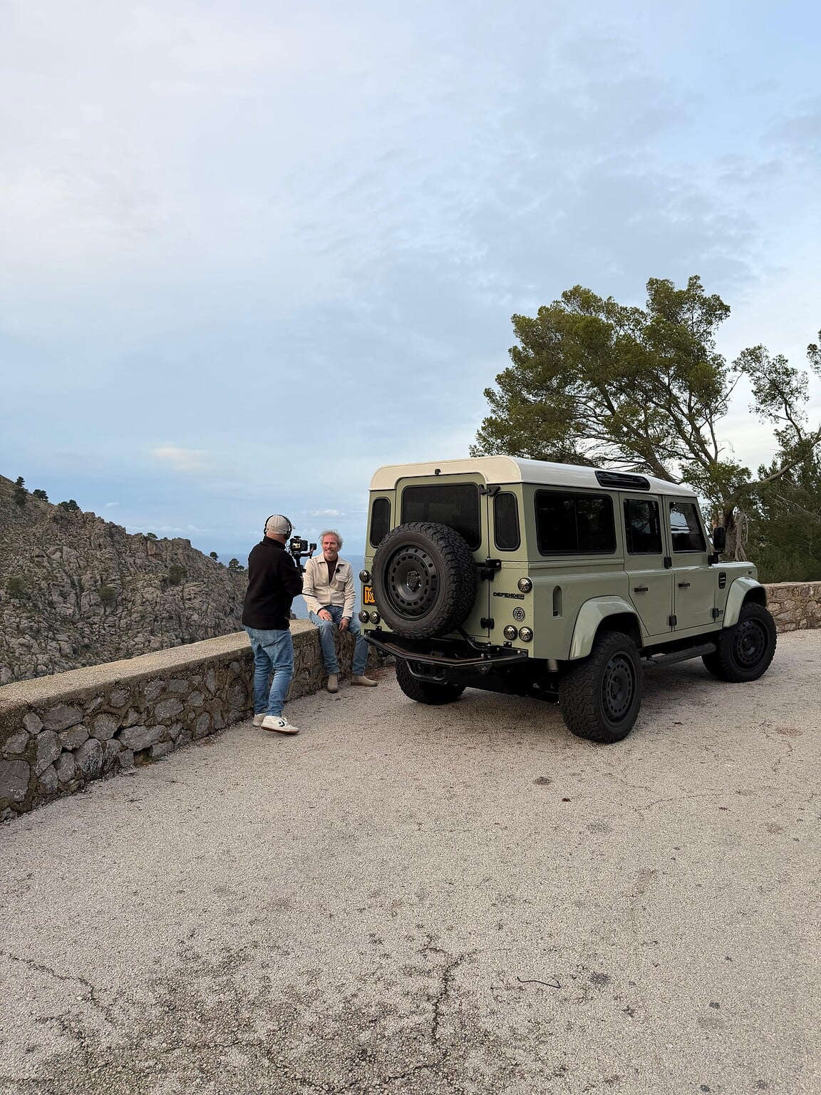 Werner Budding with cameraman and Defender Rica on scenic road on mallorca